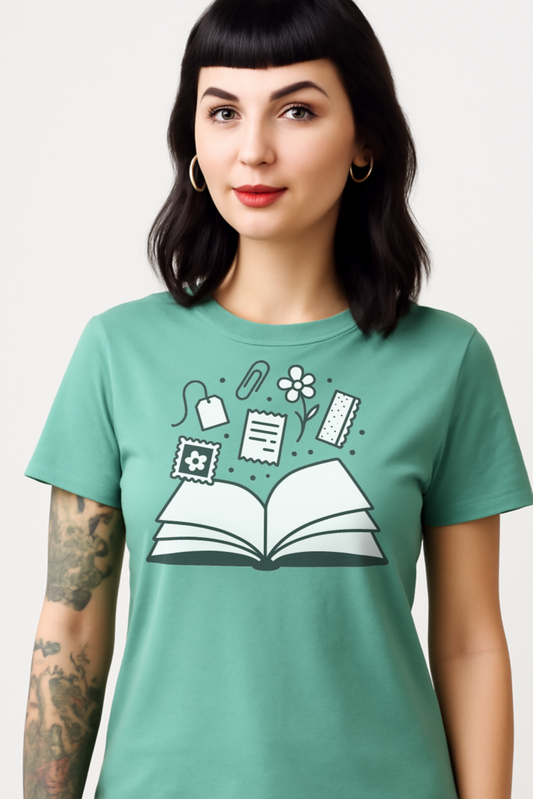 Woman wearing a teal t-shirt with a graphic design on a white background
