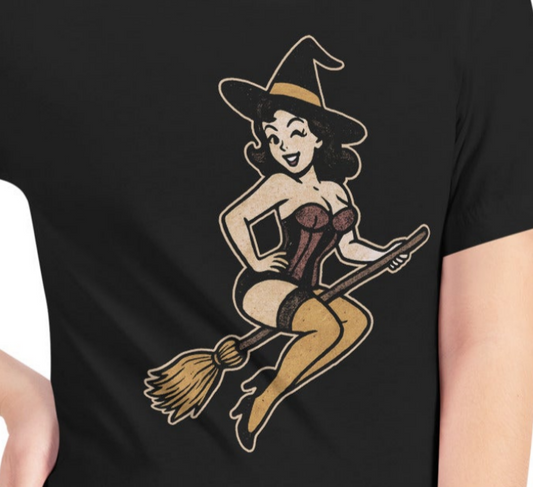 Black t-shirt with a graphic of a witch on a broomstick design.