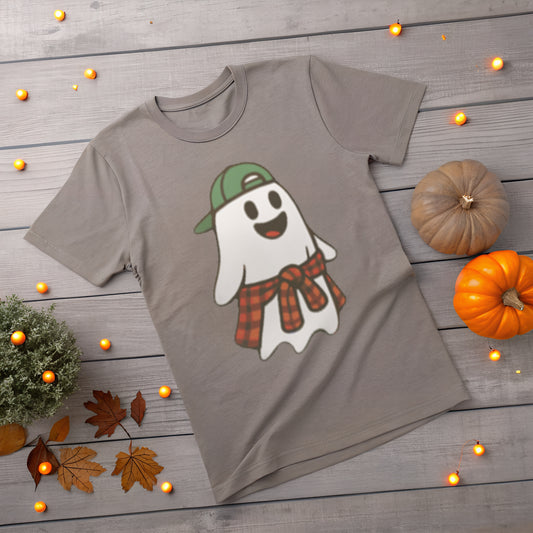 Gray t-shirt with a ghost wearing a green cap and red plaid flannel shirt on a wooden surface with pumpkins and leaves.