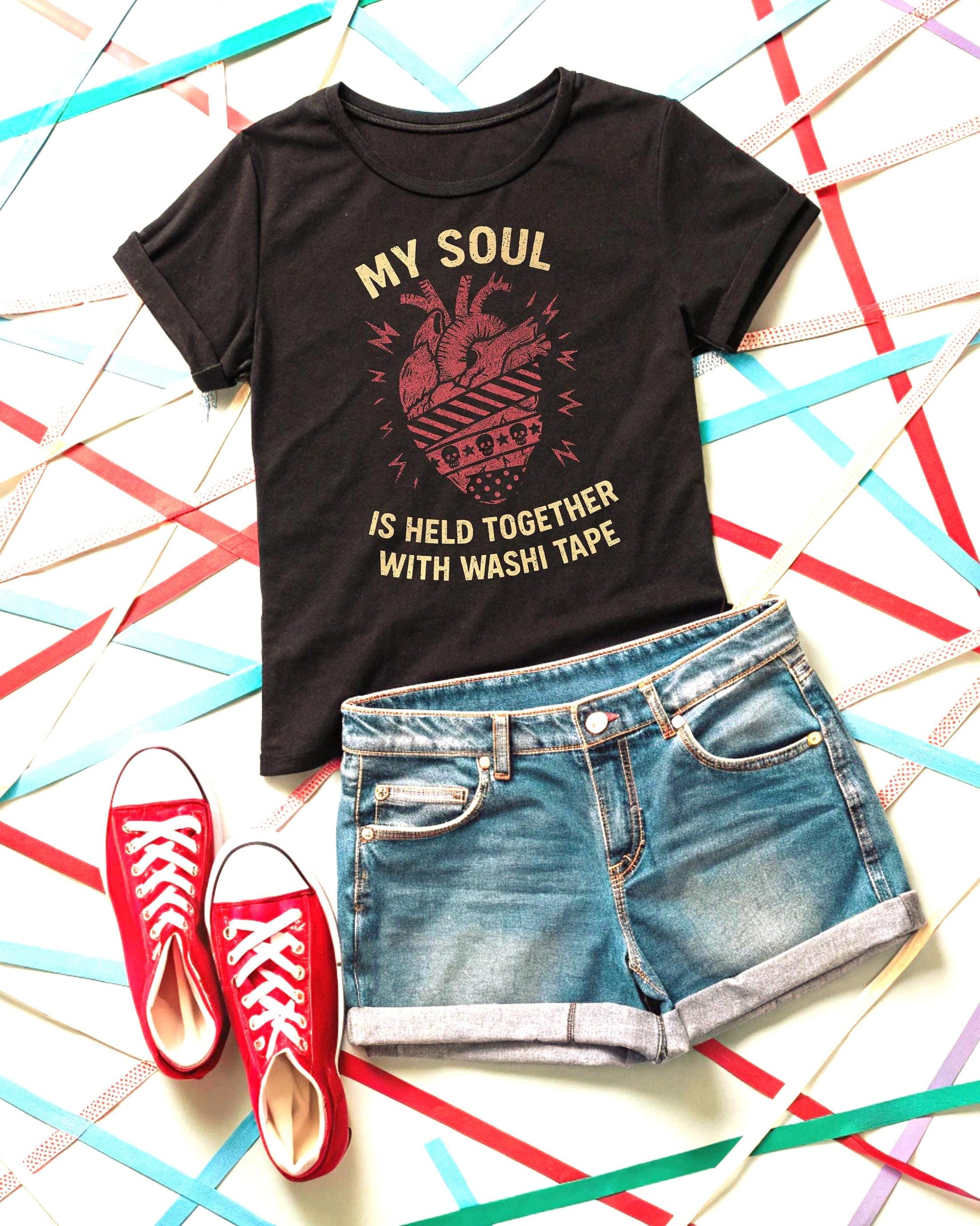 Washi Tape Junk Journal Shirt black tee with vintage heart graphic, paired with denim shorts and red sneakers.