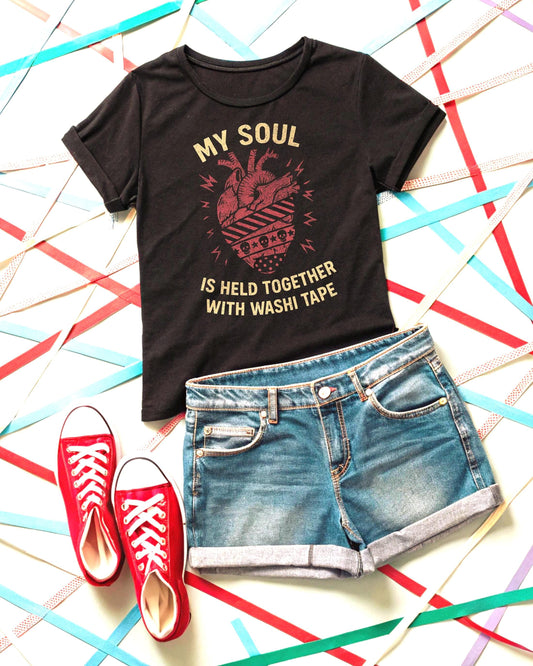 Washi Tape Junk Journal Shirt black tee with vintage heart graphic, paired with denim shorts and red sneakers.